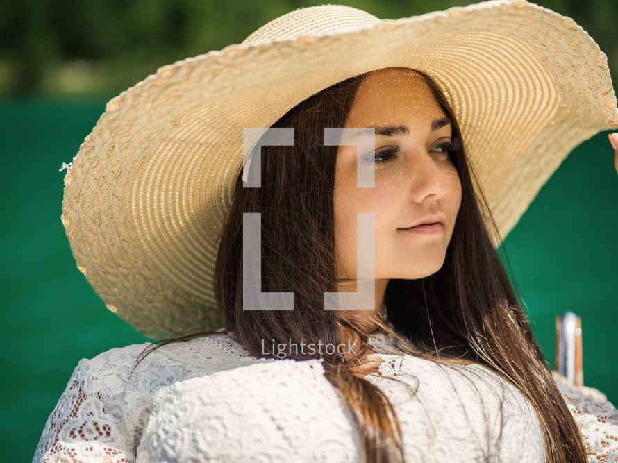 a young woman in sunhat 