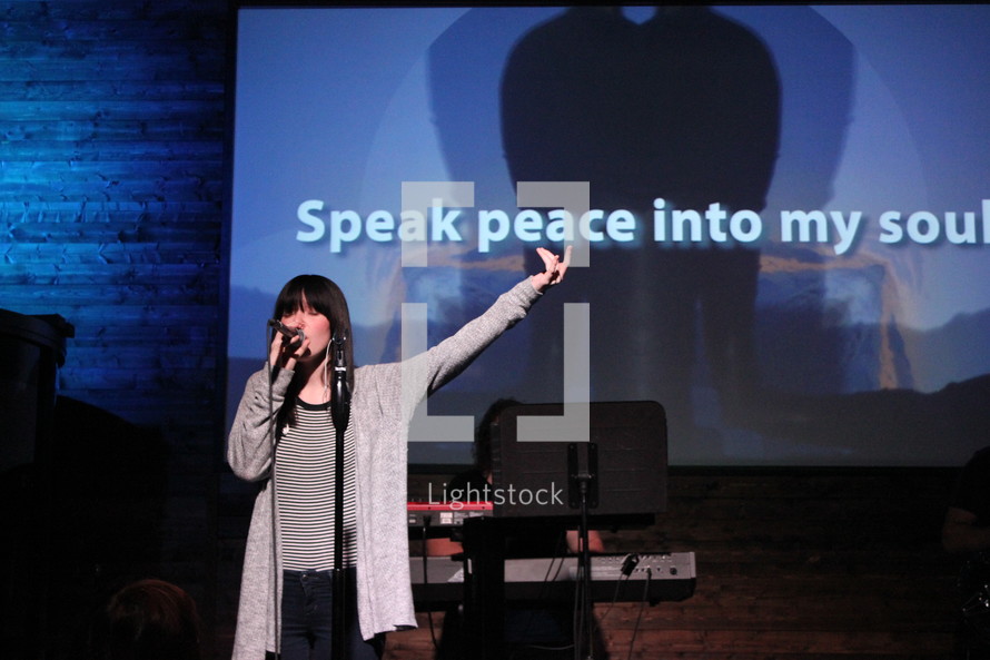 worship leader leading a congregation in song 