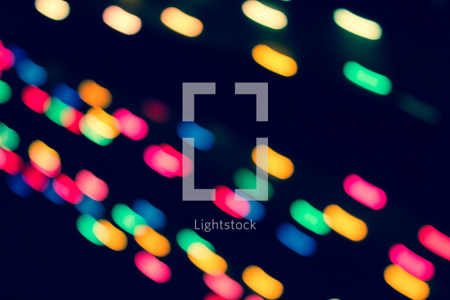 colorful bokeh lights against black 