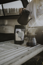a woman making pour over coffee 