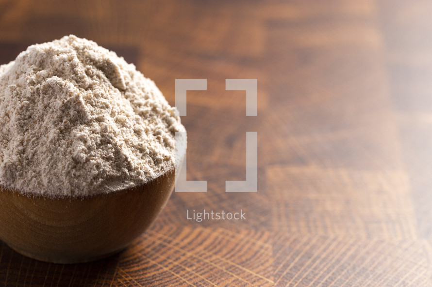 Flour in a Wooden Bowl on a Butchers Block