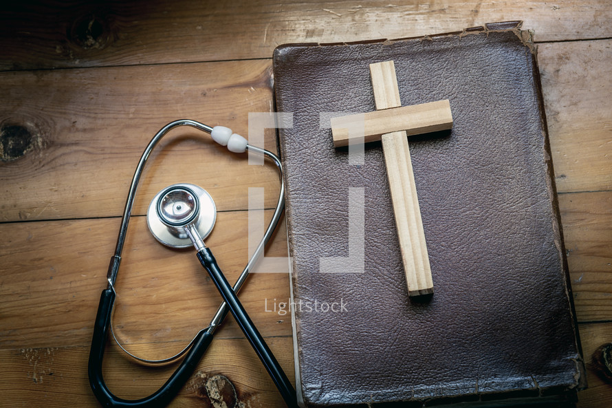 wooden cross on a Bible 