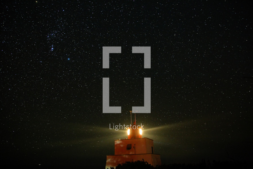 lighthouse and the night sky