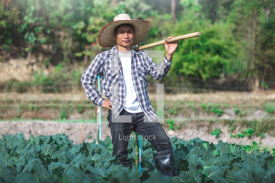 farmer standing in a garden 