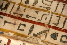 Egyptian hieroglyphics painted onto wood