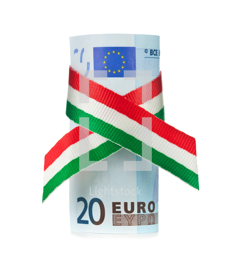 Twenty euro rolled with tricolor ribbon on white background