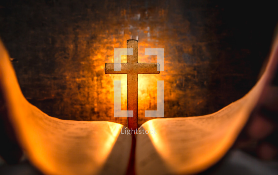 glowing cross and Bible pages 