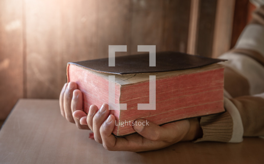 a man holding a Bible 