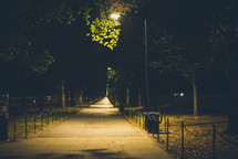 paved park walkway at night 