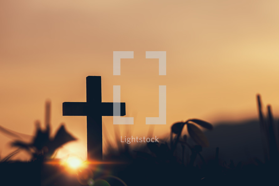 cross silhouette at sunset outdoors 