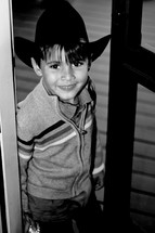 smiling boy child in a cowboy hat