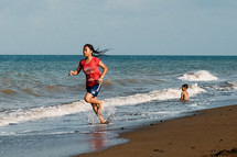 girl running on a beach 