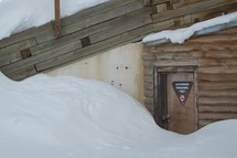 snow drift blocking a door