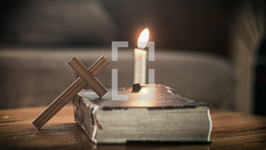 cross and Bible with candle 