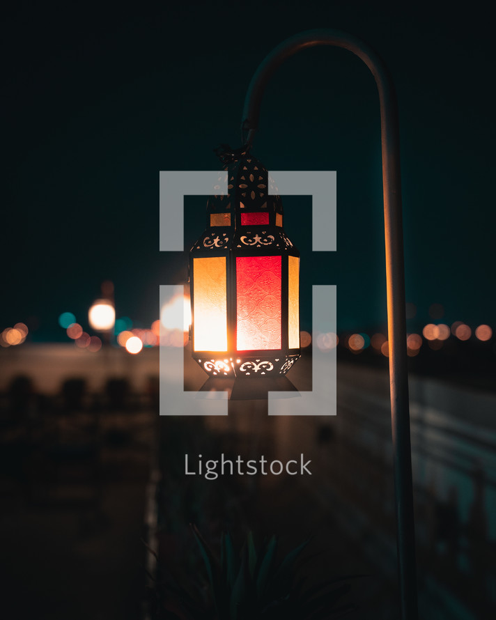 A lantern hanging on a night
