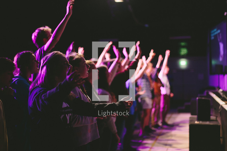 raised hands at a youth worship 