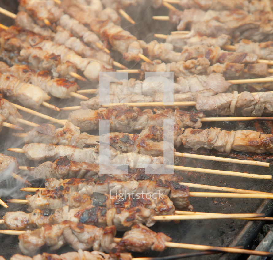 meat skewers on a grill 