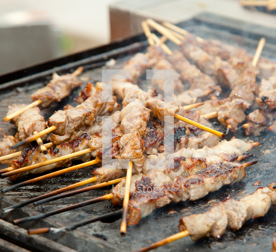 meat skewers on a grill 