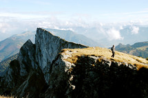 man walking on a mountaintop 