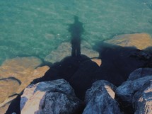 Shadow of a man in the water