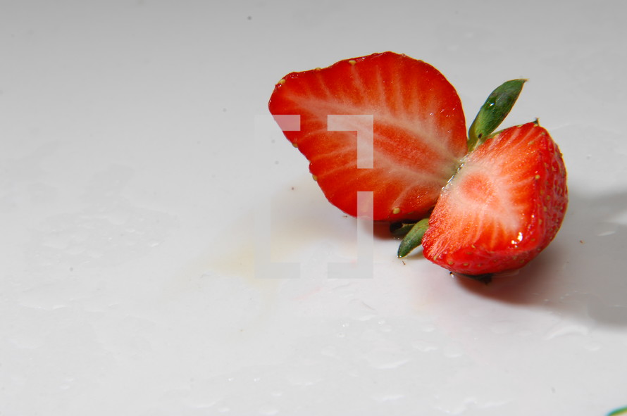 cut strawberry on a white background 