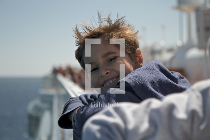 smiling child on a boat
