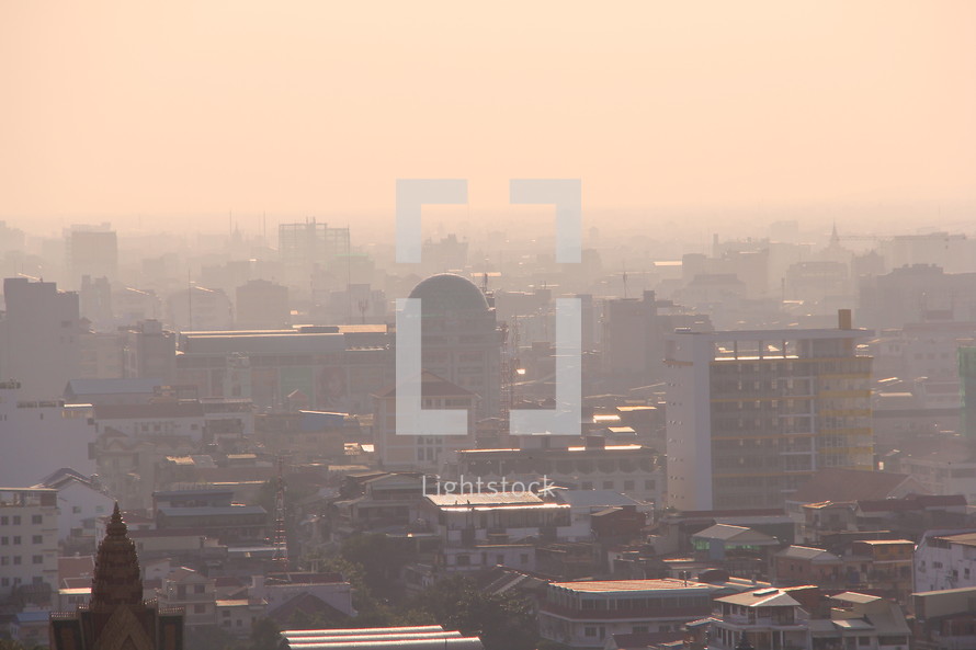 Polluted hazy dusty sky over a city  at dusk. 