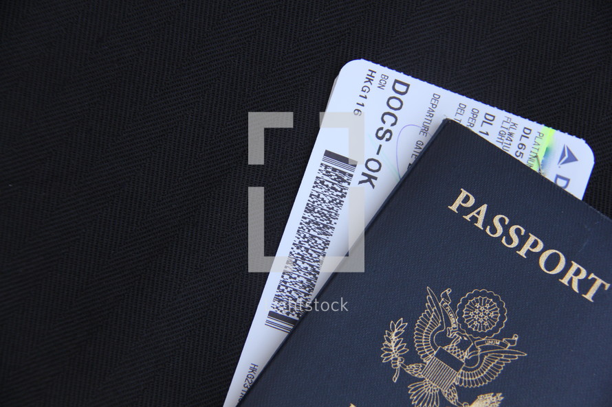 USA passport and plane ticket