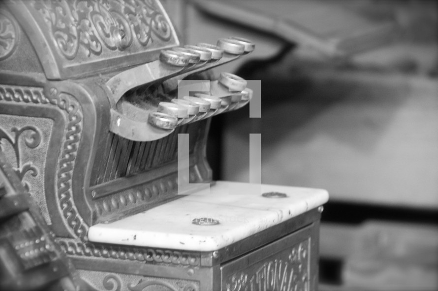 An antique cash register, the source of the expression 'Ka-ching'. 