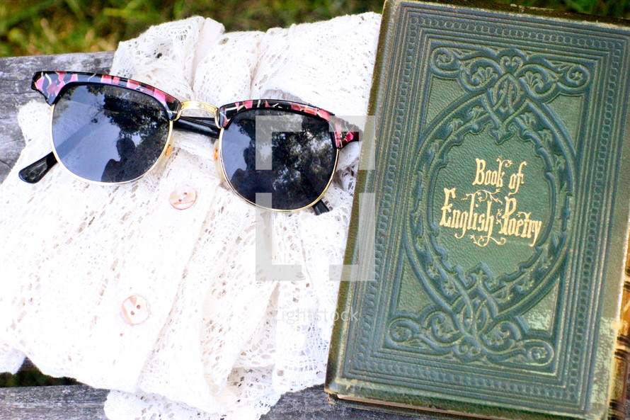 Poetry book and sunglasses