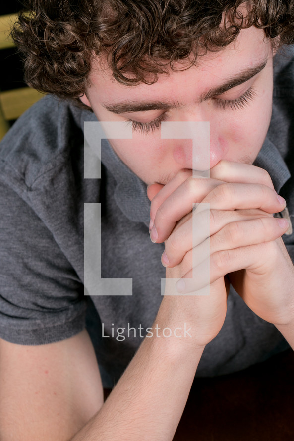 Teen praying.
