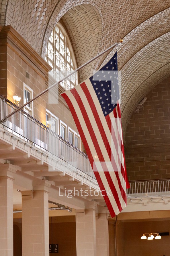 patterned tile on a ceiling and American flag 