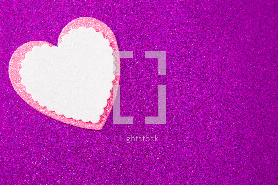 white and pink heart cutouts on purple 