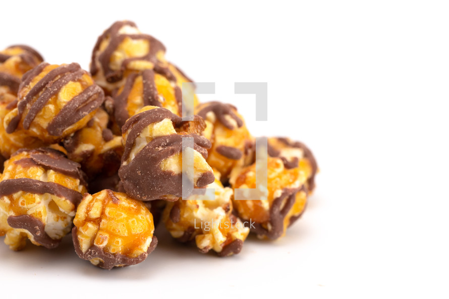 Chocolate Stripped Caramel Popcorn on a White Background