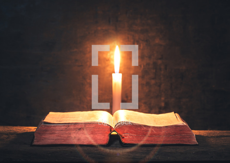 candlelight and open Bible 