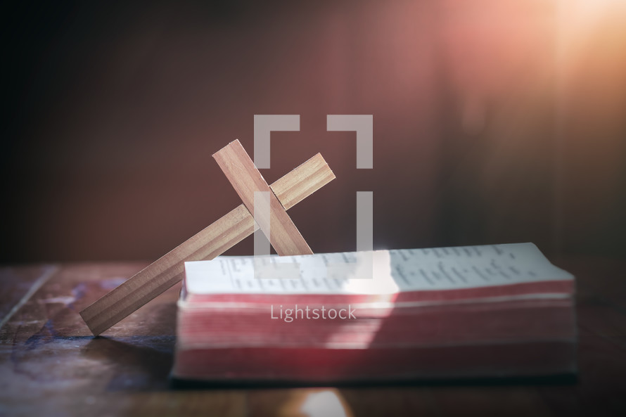 wooden cross and open Bible 