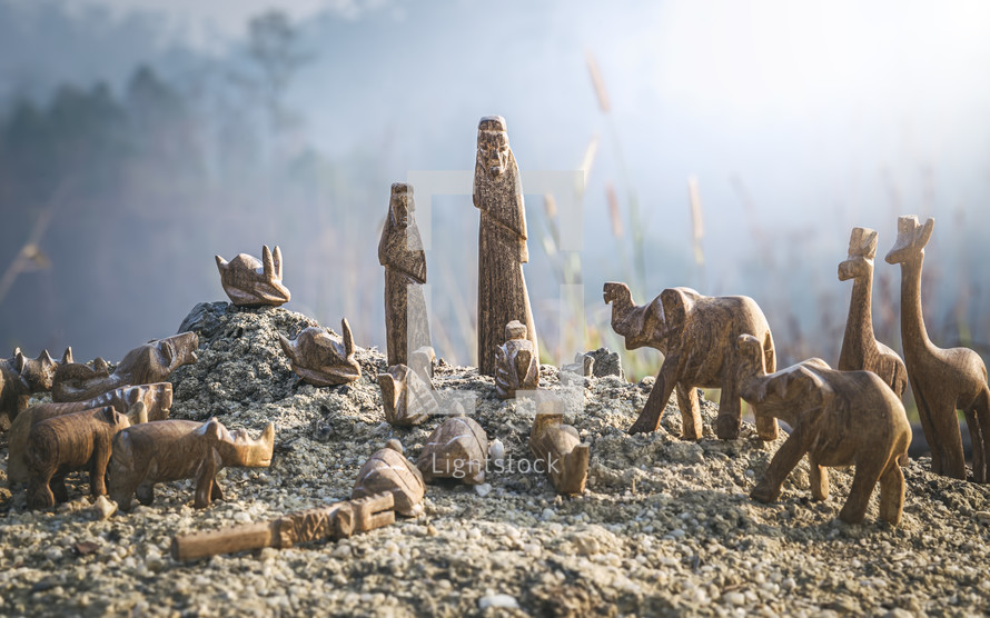 Noah's Ark carved wood figurines in ashes 