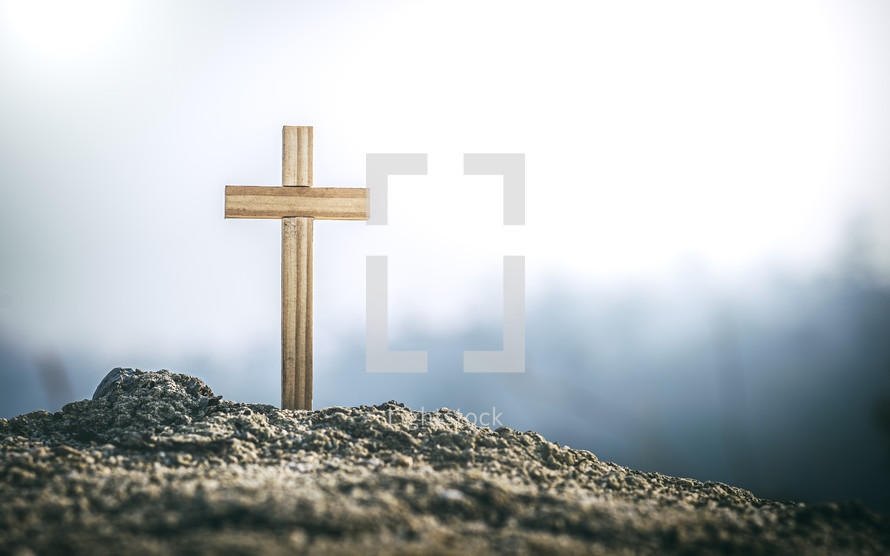 wooden cross in ashes 