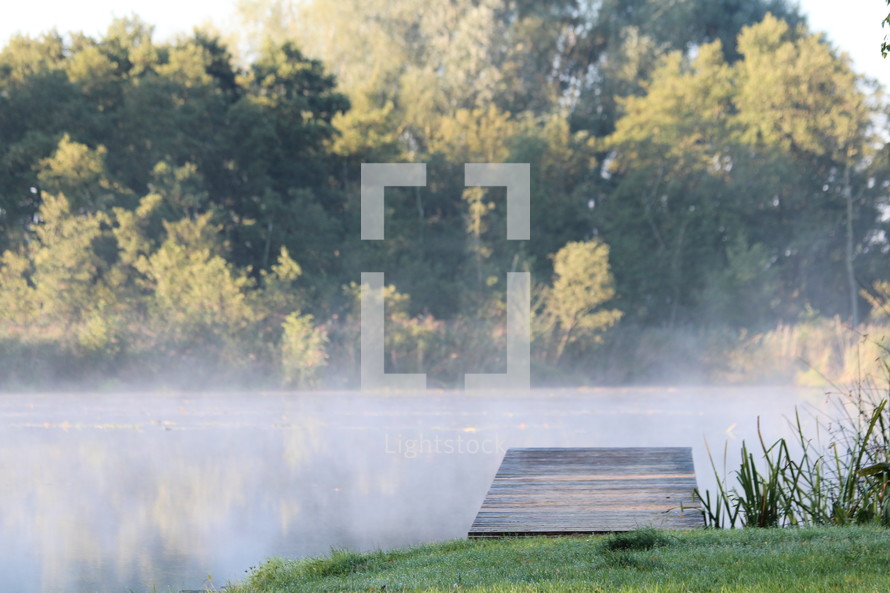 steam rising over a pond 