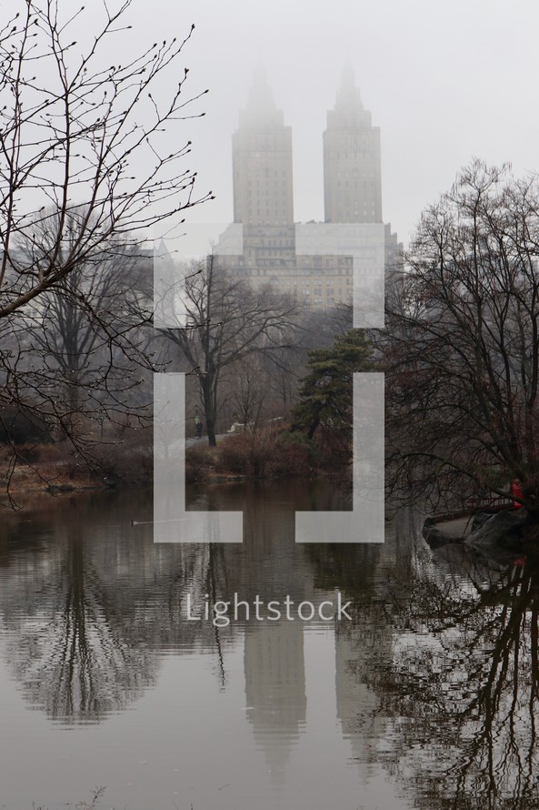 tall buildings visible through the fog 