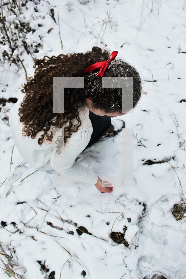 a woman playing in snow 