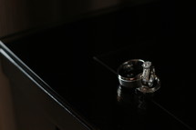 wedding rings on a dresser 