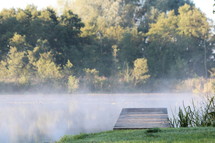 steam rising over a pond 