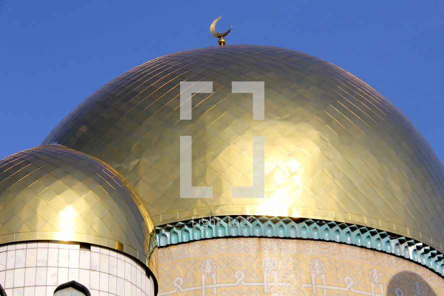 Crescent moon on a mosque dome.