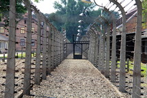 Barbed wire, electric fence and gates around a prison