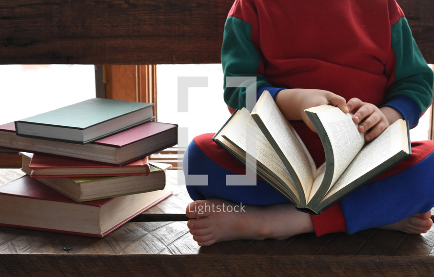 child reading books 