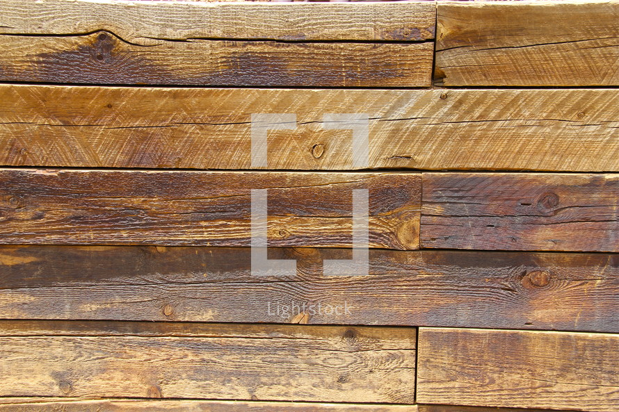Wood planks forming panelling on a wall.