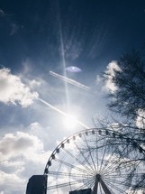 ferris wheel silhouette against the sky 