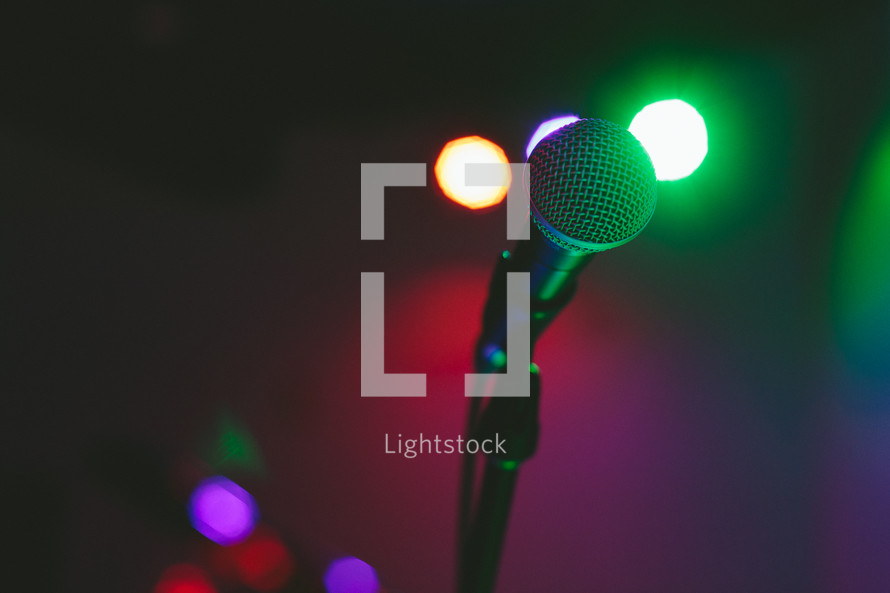 Microphone on a lighted stage.