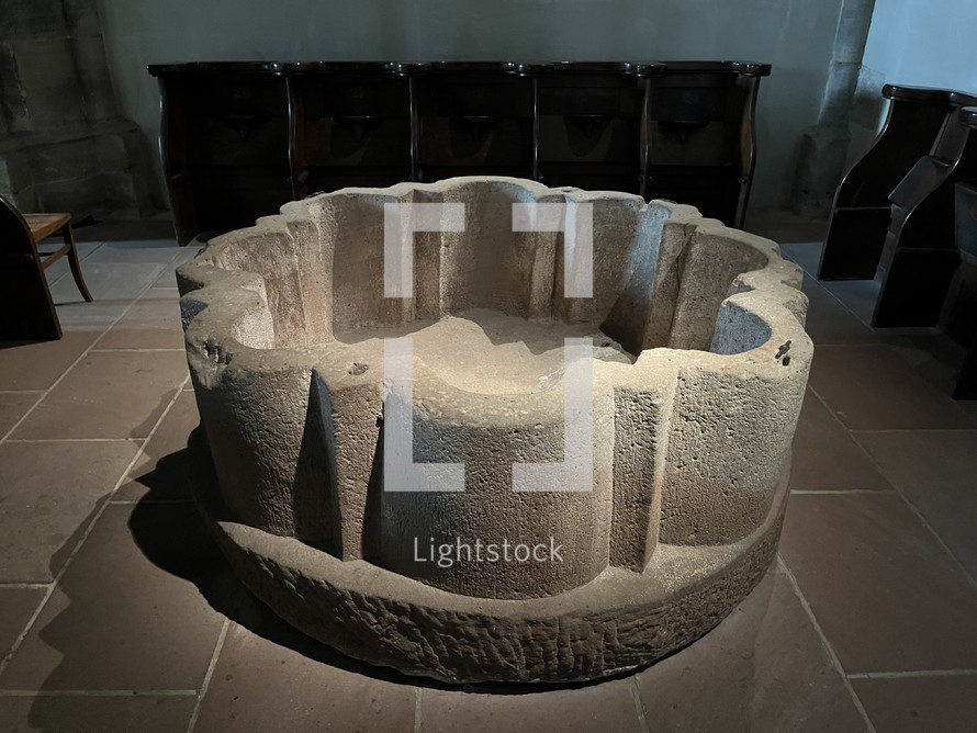 stone baptismal font in old curch